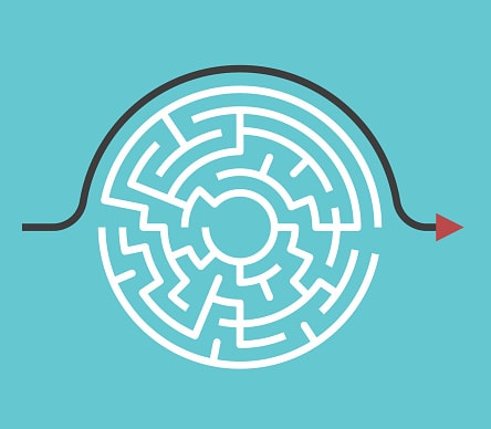 An arrow circles the outside of a round maze pointing to the exit.